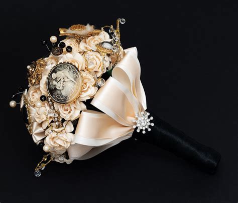 It is also the beautiful choice for all of you bold and fashion and what colour could be more bold than black for a wedding dress? elegant brooch bouquet cream gold black | OneWed.com