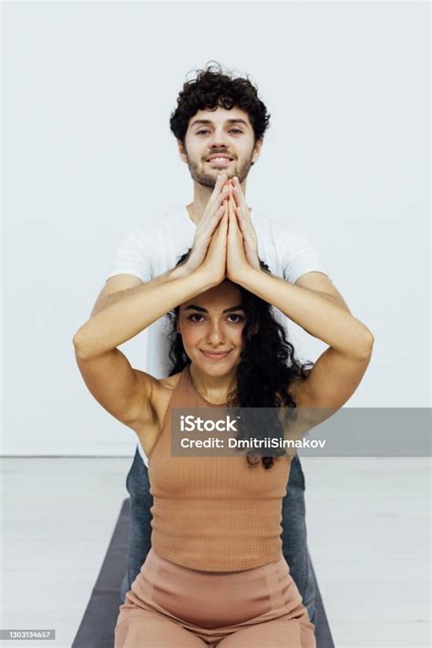Male And Female Doubles Yoga Asana Gymnastics Fitness Stock Photo