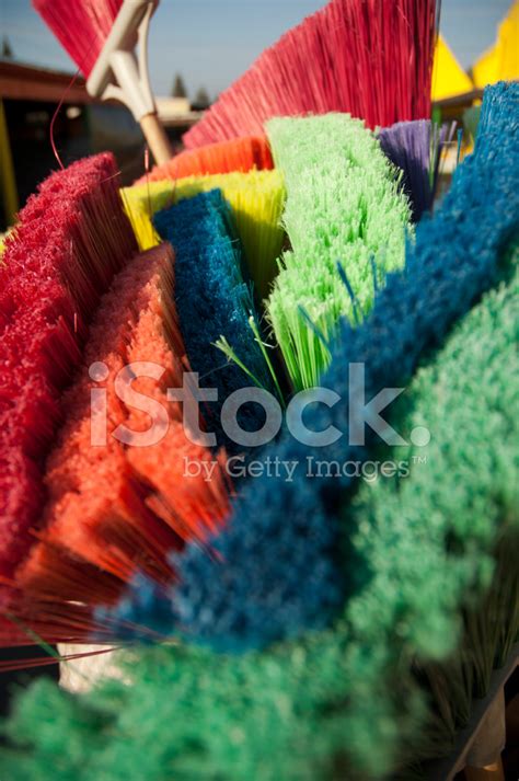 Stack Of Colorful Brooms Stock Photo Royalty Free Freeimages