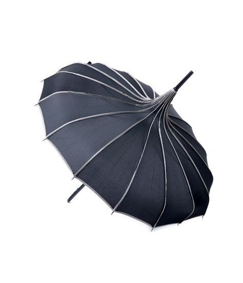 An Open Umbrella With Black And White Lines On The Bottom Against A