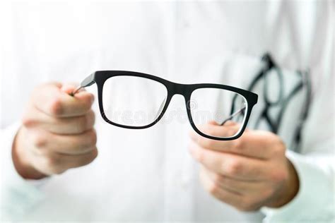 Optician Holding Glasses Eye Doctor Showing New Lenses Professional