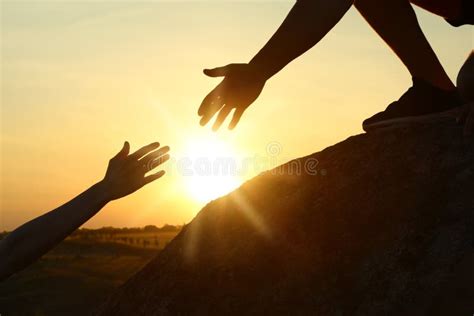 Hiker Helping Friend At Sunset Help And Support Concept Stock Image Image Of Help Adrenaline