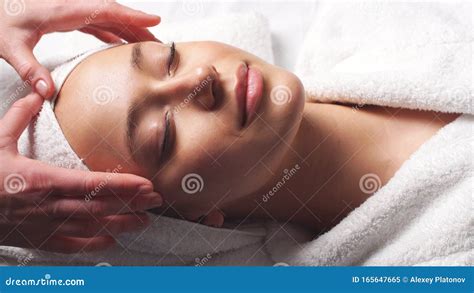 Spa Woman Facial Massage Female Enjoying Relaxing Face Massage In Cosmetology Spa Centre Stock