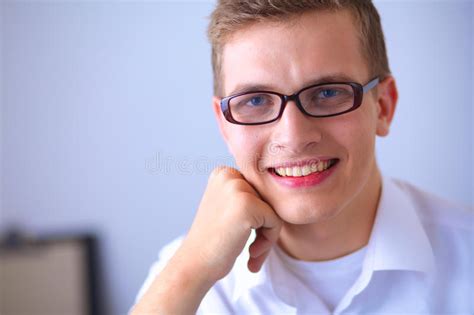 Young Businessman Working In Office Sitting Near Stock Image Image