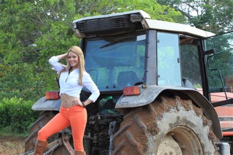 Countrygirl Posing At The Back Of Tractor Stock Photo Download Image