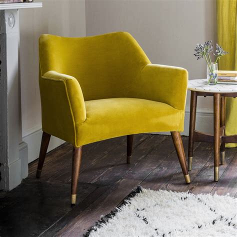 If your kitchen feels starved for natural light or could use a few pops of warming color, explore these yellow spaces with a bright, sunshine vibe. Astoria Chair in Mustard Yellow Velvet with Brass Caps
