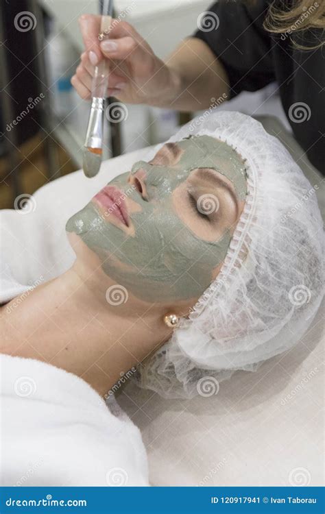 Young Beautiful Girl Receiving Facial Mask In Medical Spa Beauty Salon Indoors Stock Image