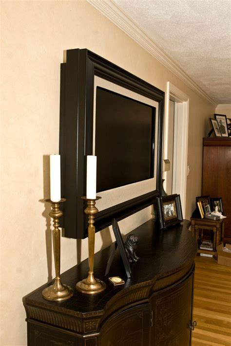 Your eye level is calculated, not standing, but sitting where you'll be watching the tv. frame a wall-mounted tv. Love the way this looks, but it's ...