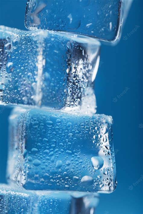 Premium Photo Frosty Ice Cubes In The Form Of A Tower On A Blue