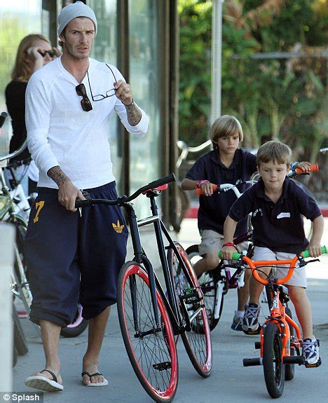 David Beckham Tries Geek Chic While Bicycle Shopping With Romeo Cruz
