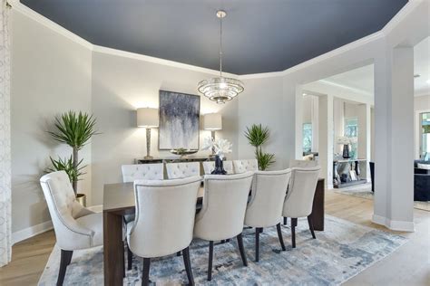 Painting This Ceiling Blue Adds A Touch Of Drama To This Dining Room