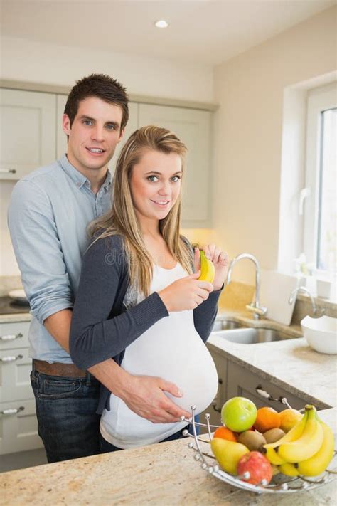 Pregnant Woman Holding Banana With Partner Stock Image Image Of