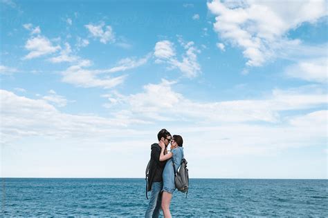 Couple Hugging Against The Sea By Stocksy Contributor Simone Wave