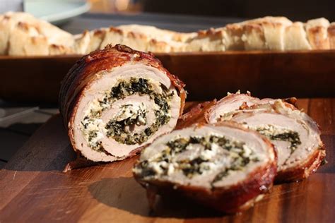 Grill the pork over direct medium heat, with the lid closed, until the meat is barely pink in the center and the bacon is fully cooked, 10 to 13 minutes, turning once. Spinach and Cheese Stuffed Bacon Wrapped Pork Tenderloin