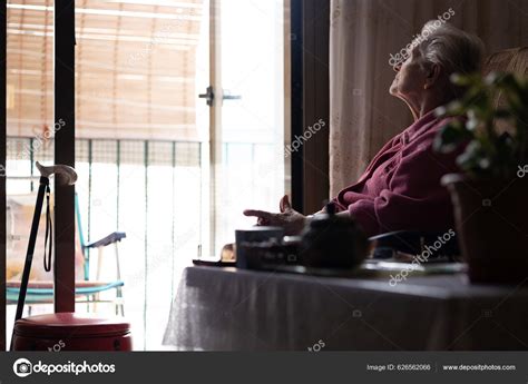 Lonely Old Woman Home Looking Out Window Stock Photo By ©dapetrus 626562066