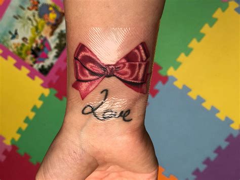 Pink Bow Tattoo On Wrist 🎀 Love Sureno Tattoos Bow Tattoo Designs