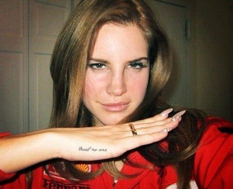 In a 2013 interview with fashion magazine she spoke highly of the late. Lana del Rey's "trust no one" tattoo is her in a nutshell ...