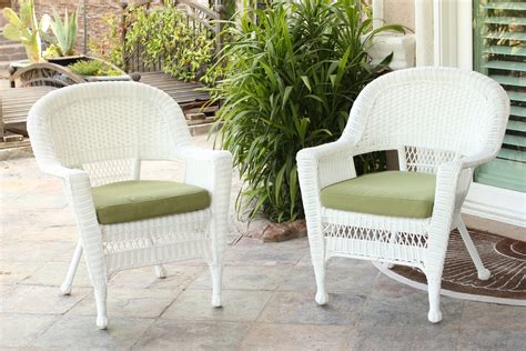Wooden rattan armchairs with console and green plant. White Wicker Chair With Sage Green Cushion | Bazaar Home