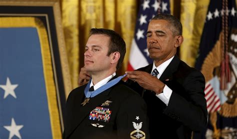 A Seal Team 6 Member Steps Out Of The Shadows To Receive The Medal Of