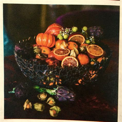 For example, use light colored rugs to pull light into a room with dark flooring (rugs, by the way, are a good idea with any type of wood flooring to add color). Oranges with Dark plum colored basket. Maybe interesting ...