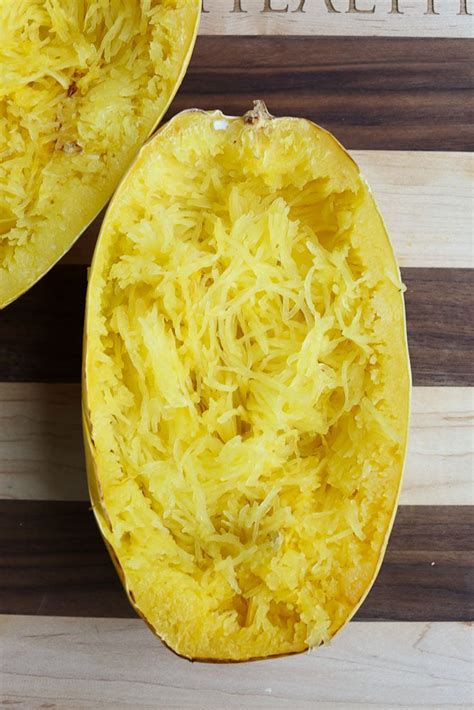 Use a spoon to remove the seeds. How to Cook Spaghetti Squash 4 Ways - Happy Healthy Mama