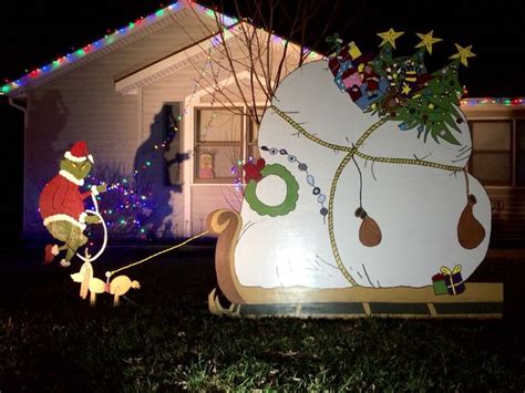 This decoration is unique in that you it shows the reformed grinch and what christmas is really all about. The grinch wood cutout scene , yard art. | Grinch christmas decorations, Christmas yard ...