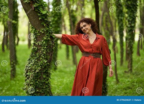 candid of a mature curly hair redhead woman stock image image of nature seasonal 279624631