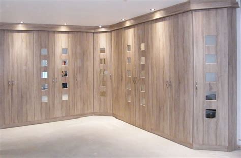 We always need more wardrobe storage: Contemporary fitted wardrobe design with wooden style ...