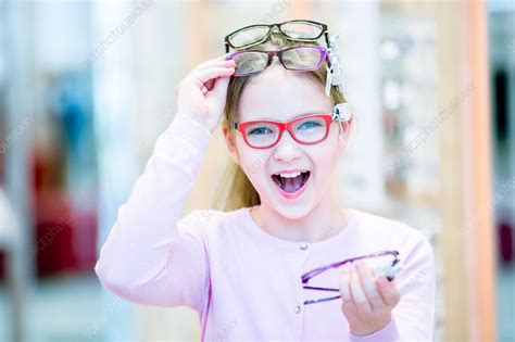 Girl Trying On Glasses Stock Image F018 2837 Science Photo Library