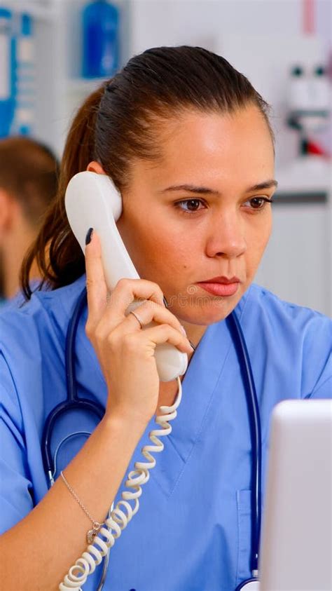 Medical Practitioner Answering Phone Calls Stock Photo Image Of Nurse
