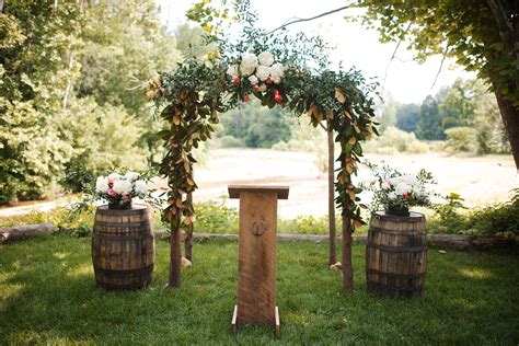 Natural Wooden Wedding Arch With Greenery
