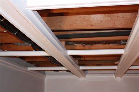 They come in a ton of styles and can be humidity and mold resistant and offer various levels of sound insulation. Jazz Up Your Basement Ceiling | Drop ceiling basement ...