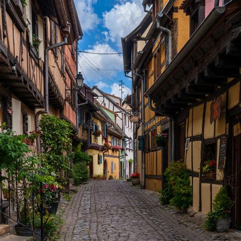 Narrow Cobblestone Street With Colorful Historic Half Timbered Houses