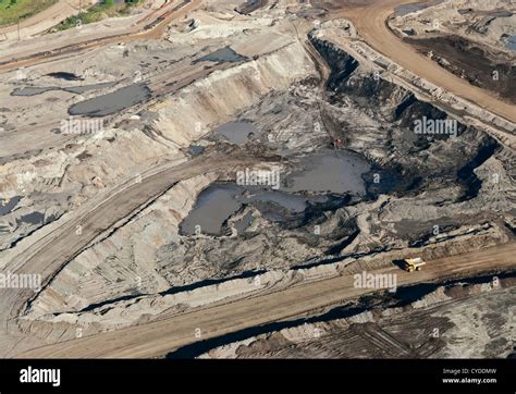 An Aerial View Of Active Bitumen Open Pit Mining In The Athabasca