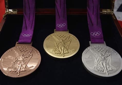Three Gold Silver And Bronze Medals In A Case
