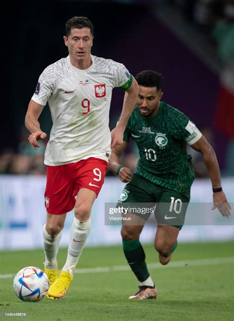 Robert Lewandowski Of Poland And Salem Al Dawsari Of Saudi Arabia In