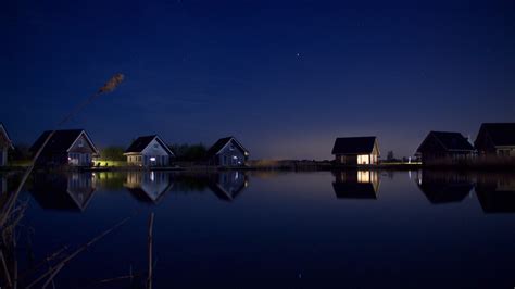 2048x1152 Houses At Lake Water Starry Night 2048x1152 Resolution