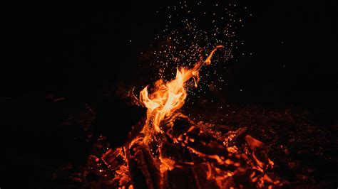 Download Wallpaper 2048x1152 Bonfire Fire Sparks Dark Night
