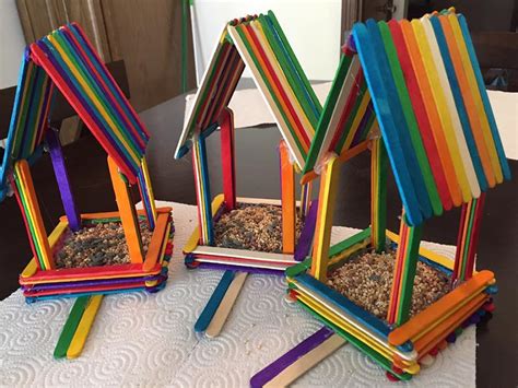 A lego birdhouse might be the perfect thing to do! Rainbow Popsicle Stick Birdhouses - Crafty Morning