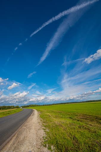 Green Field With Country Road Summer Landscape With Clouds Stock Photo