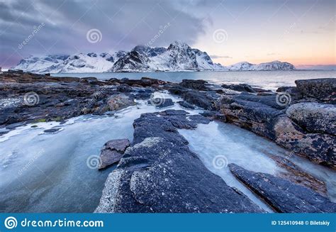 Seashore With Stones And Ice During Sunset Beautiful Natural Seascape