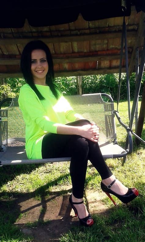 Tanned Brunette Sitting On A Bench In Black Joga Kar0
