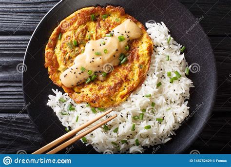 Cornstarch is used to make nice and thick gravy. Chinese Omelette Egg Foo Young Served With Rice Close-up. Horizontal Top View Stock Image ...