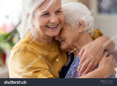 Woman Hugging Her Elderly Mother ภาพสต็อก 1754654687 Shutterstock