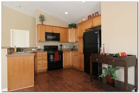 Select a light color, such as a taupe, ivory or light gray, that offsets the shade of the cherry wood. Awesome Laminate Wood Flooring in Kitchen Ideas - The ...