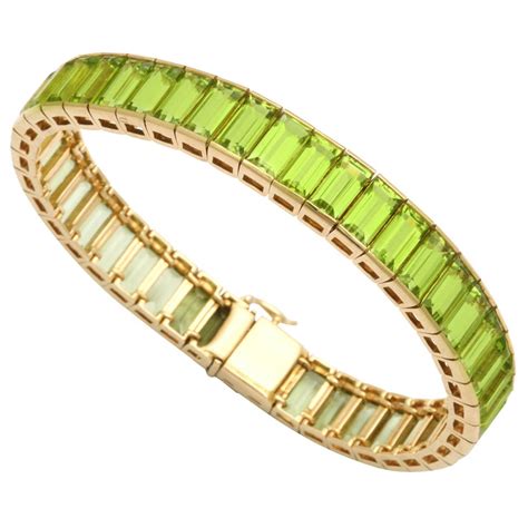Discover expertly crafted bracelets for women in an array of different bracelet designs. 1960s Square Cut Peridot Gold Straightline Bracelet at 1stdibs