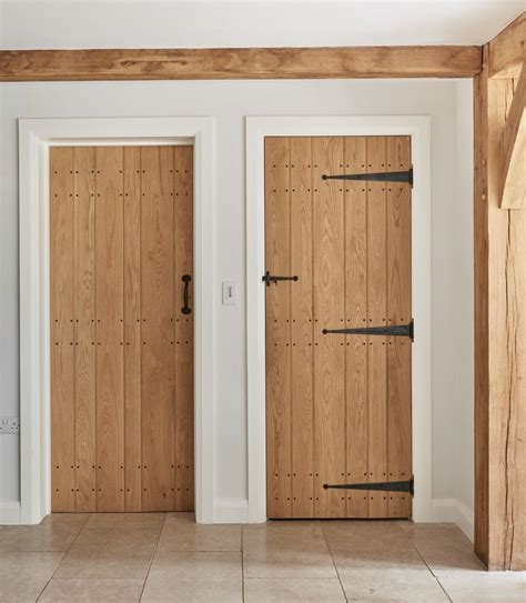 Oak Ledge And Boarded Doors With Painted Architrave And Skirting