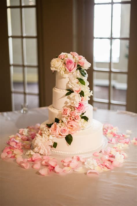 White Buttercream Cake With Cascading Blush And Ivory Flowers With