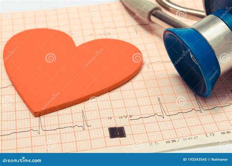 Medical Stethoscope And Heart Shape Lying On Electrocardiogram Graph