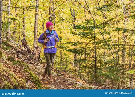 Autumn Hike Woman Walking On Forest Trail With Yellow Leaves Foliage